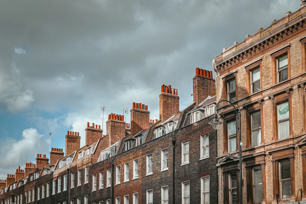 Brick terrace with chimneys under a cloudy sky