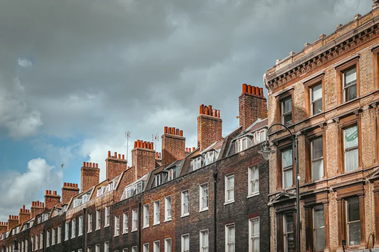 Brick terrace with chimneys under a cloudy sky