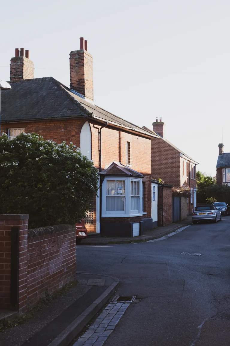 Suburban brick houses with bay windows