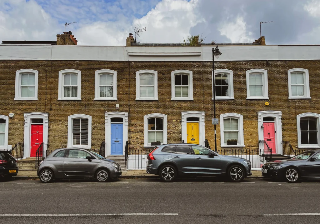 Row of terraced houses with coloured front doors
