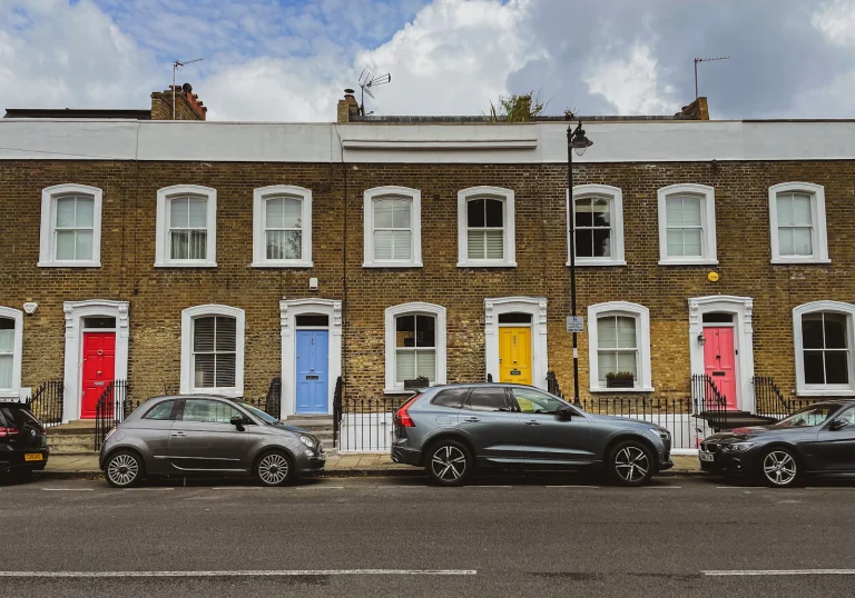 Row of terraced houses with coloured front doors