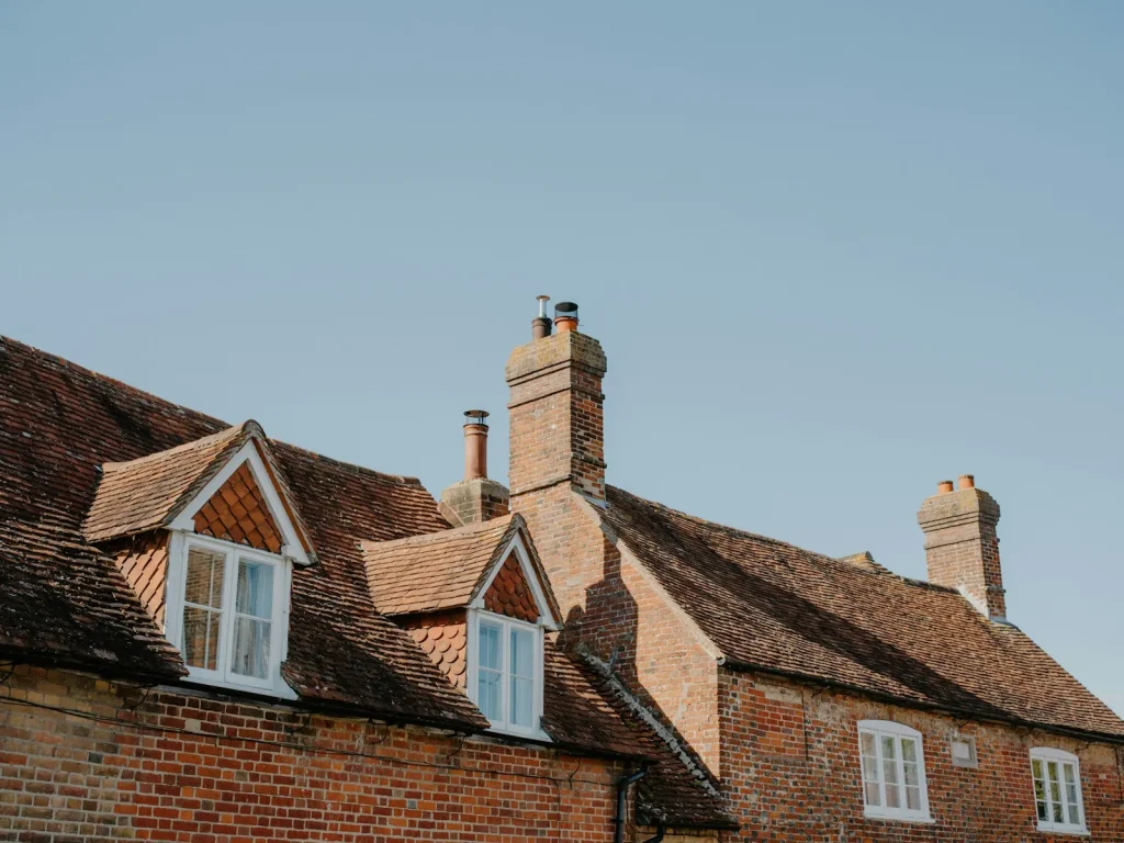 Tiled roof with dormer windows and a chimney
