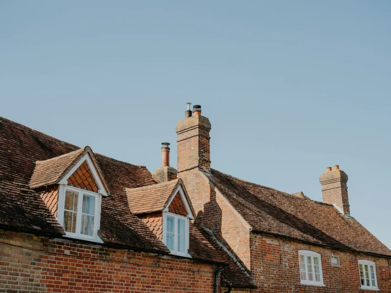 Tiled roof with dormer windows and a chimney