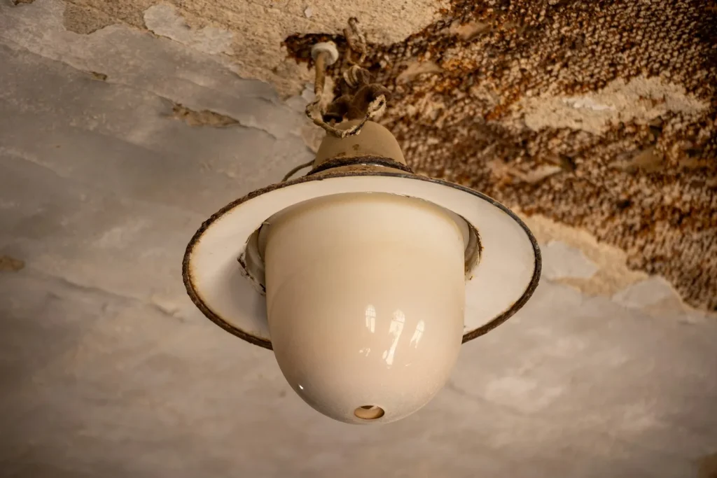 Water-stained ceiling around a light fitting